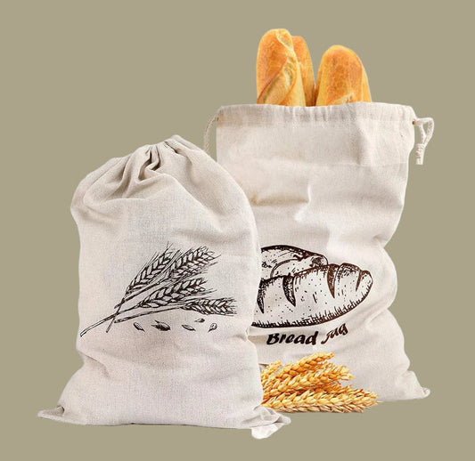 Two natural linen bread bags with wheat illustrations and text indicating 100% natural linen.