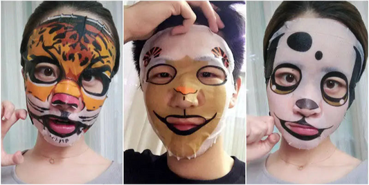 Four animal-themed face masks with corresponding packaging on a white background.