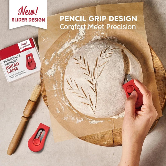 Bread lame with leaf design on bread, surrounded by flour, with promotional text about new slider design.