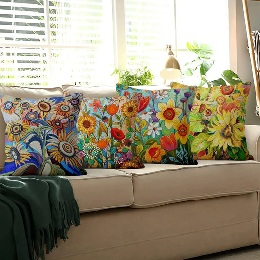 Colorful floral-patterned pillows on a beige sofa with a window in the background