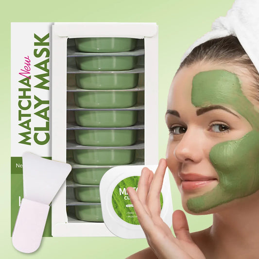Woman applying matcha clay mask with packaging in the background