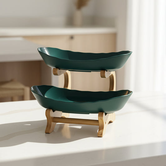 Two green ceramic bowls on a wooden stand with KEMORELA branding.