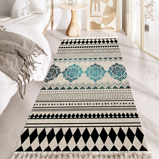 Patterned rug with geometric design on a light-colored floor.