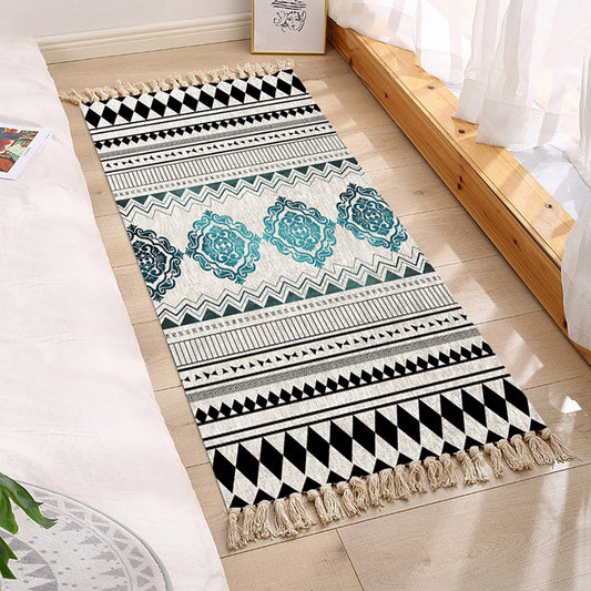Decorative rug with geometric pattern on a wooden floor