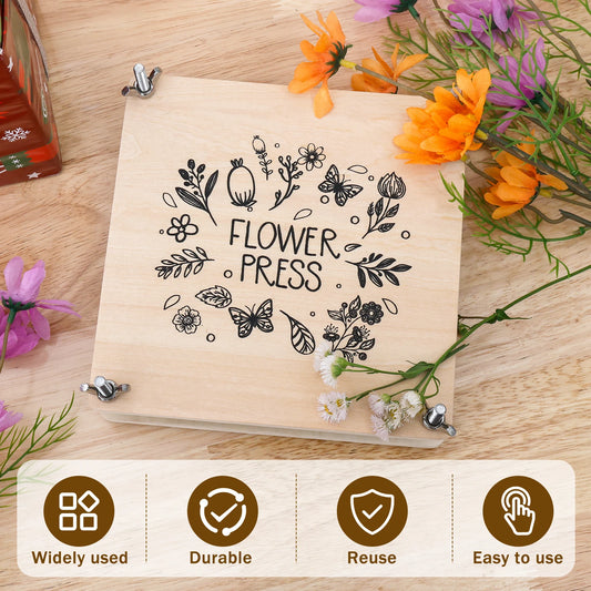 Flower press with floral design on a wooden surface with flowers around