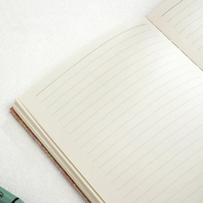Open notebook with lined pages on a white background