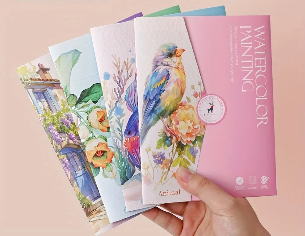Set of watercolor painting books with colorful designs on a beige background