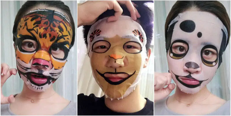 Four animal-themed face masks with corresponding packaging on a white background.