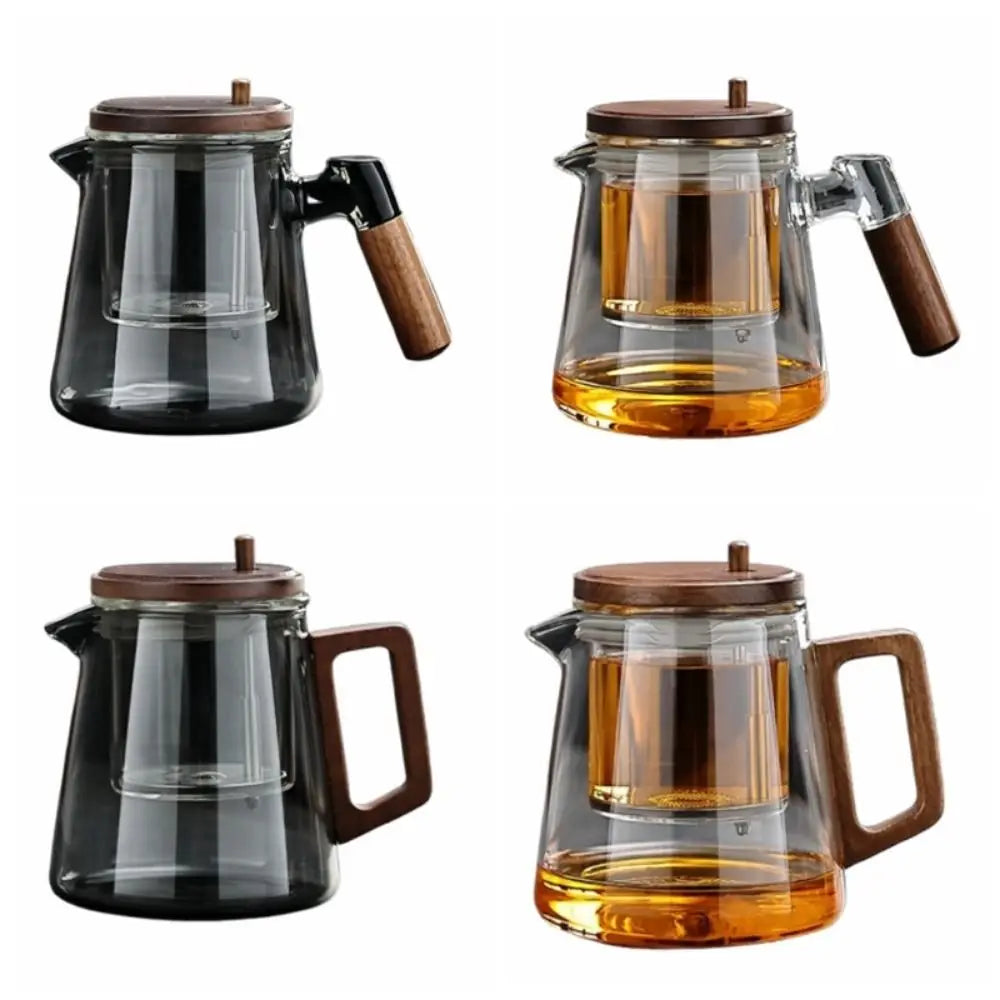 Four glass teapots with wooden handles and lids on a white background