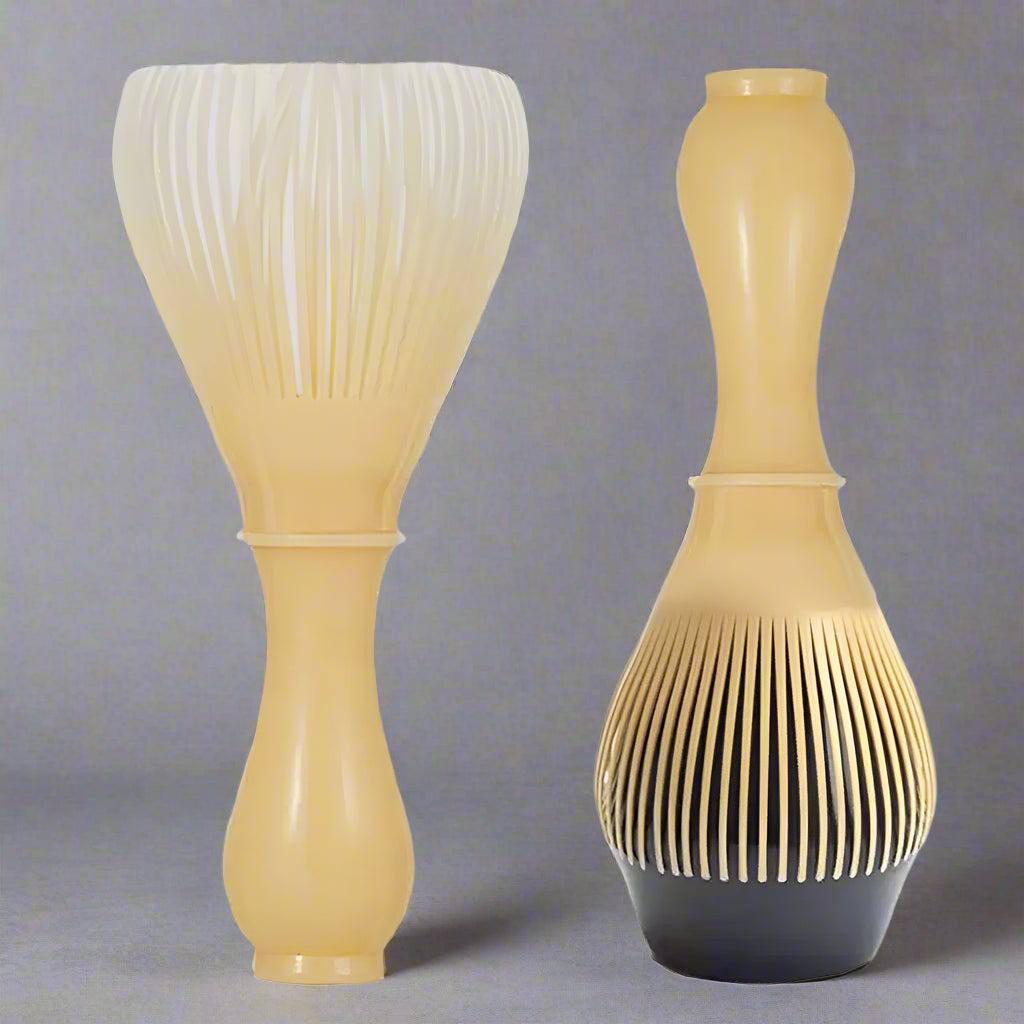 Set of two beige and black hairbrushes on a white background