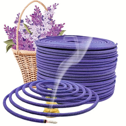 Purple garden hose with a basket of purple flowers on a white background