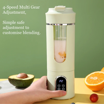 Personal blender with ingredients on a wooden surface against a green background