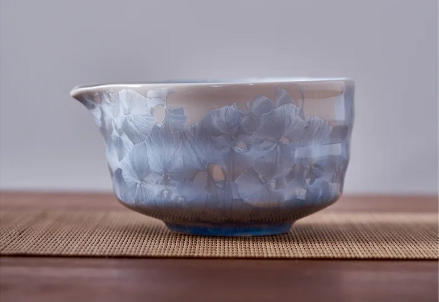 Ceramic bowl with blue and white pattern on a wooden surface