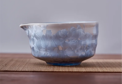 Ceramic bowl with blue and white pattern on a wooden surface
