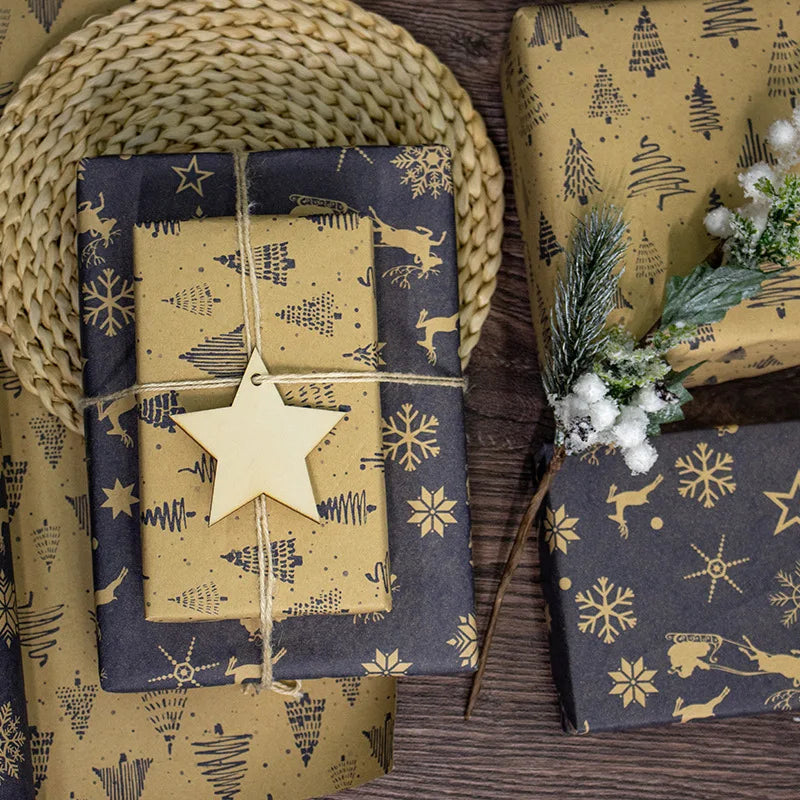 Gift boxes wrapped in festive paper with star decorations on a wooden surface.