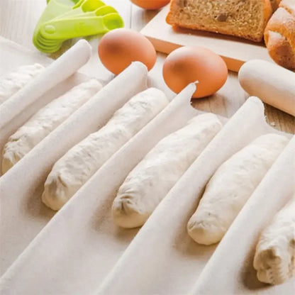 White carrots on a wooden surface with eggs and bread in the background
