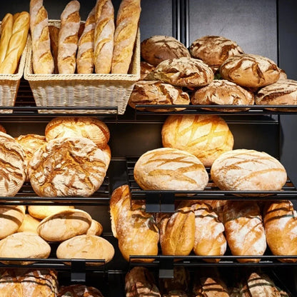 Display of various types of bread in a bakery setting