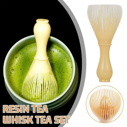 Resin tea whisk set with a bowl of green tea on a white background