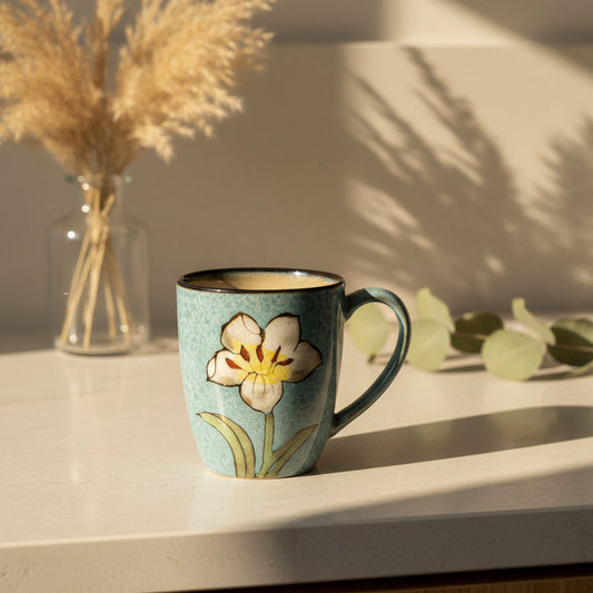 Ceramic mug with floral design on a white background