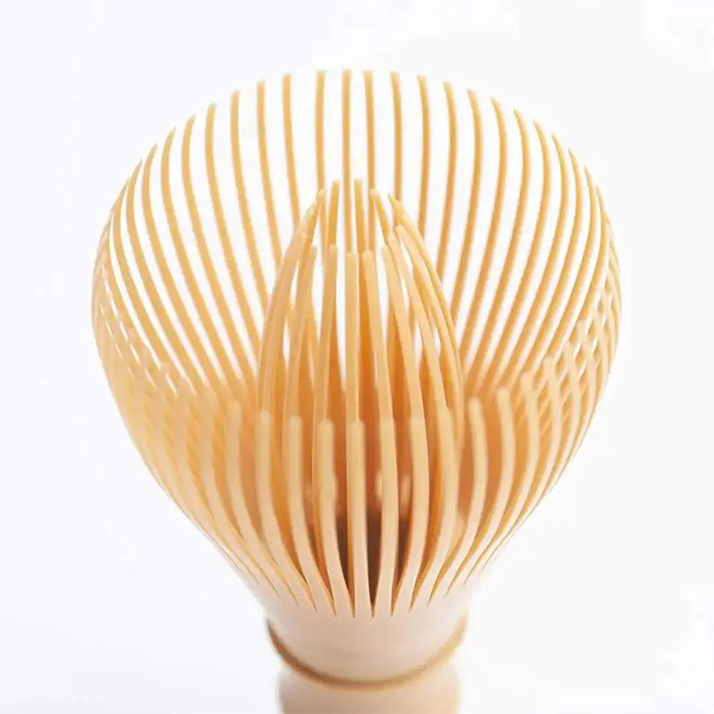 Wooden whisk with a unique design on a white background