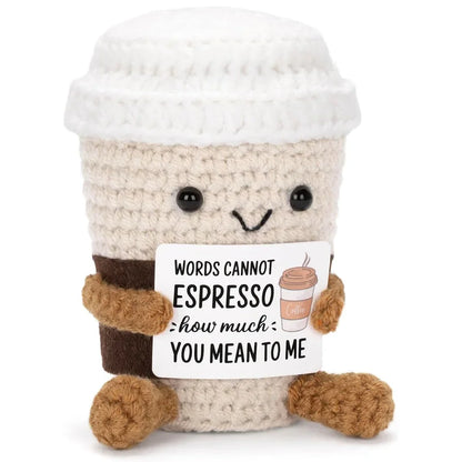 Plush toy resembling a coffee cup with a humorous message on a white background