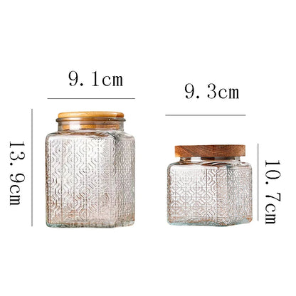Two glass jars with wooden lids and measurements on a white background