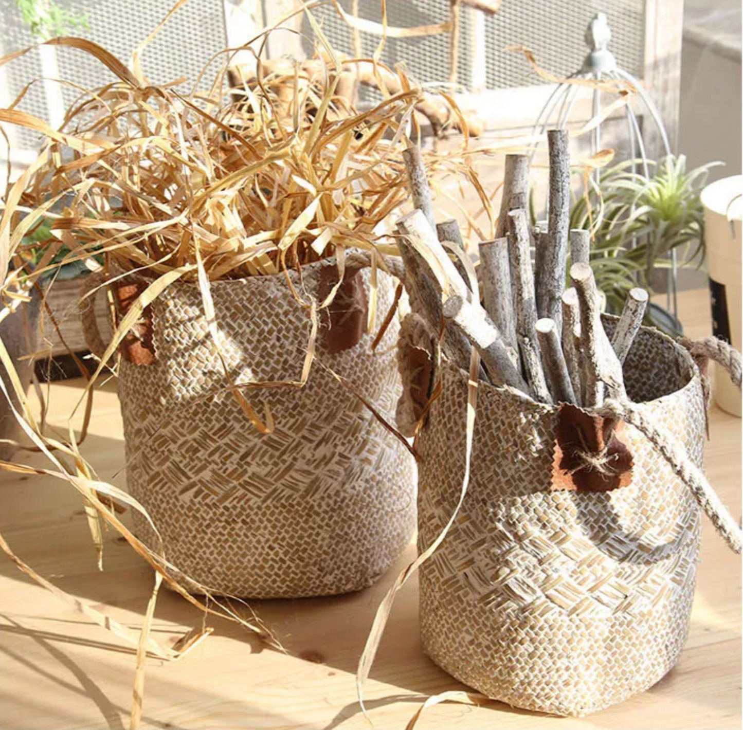 Two woven baskets with decorative items on a light surface.
