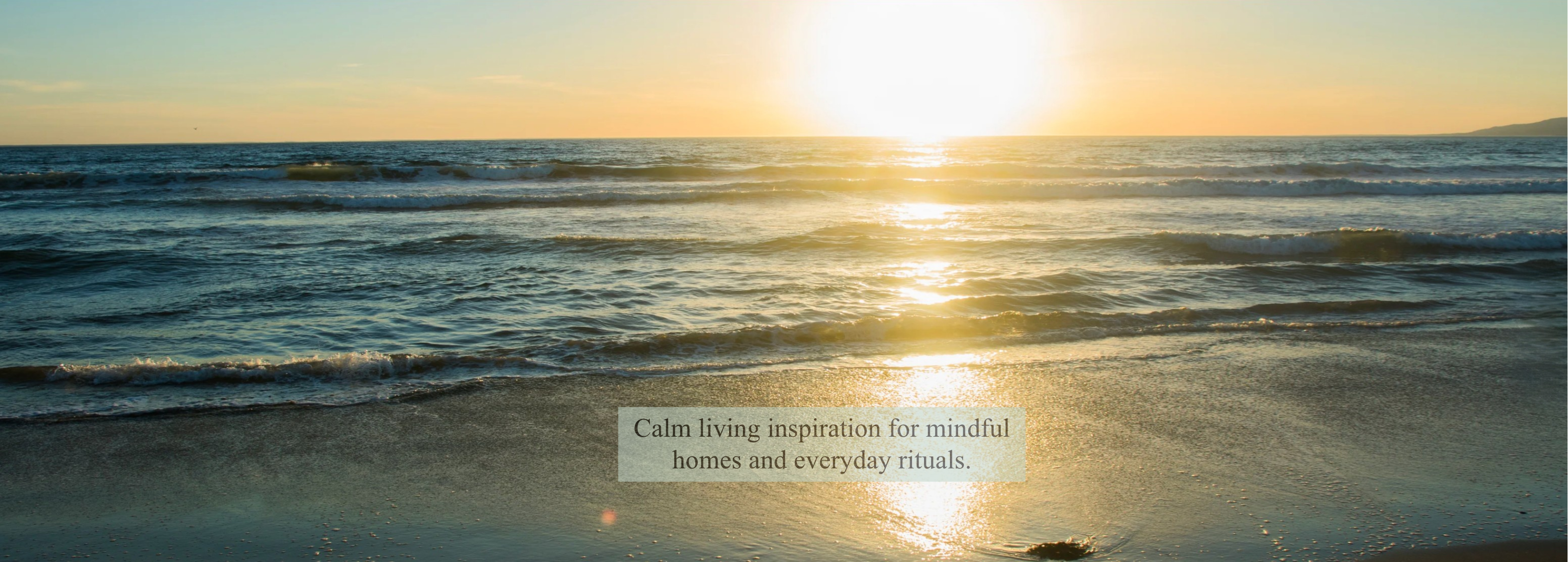 Sunset over a calm ocean with a text overlay on a white background