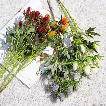 Assorted artificial flowers on a textured surface
