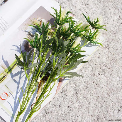 Bouquet of green plants on a textured surface