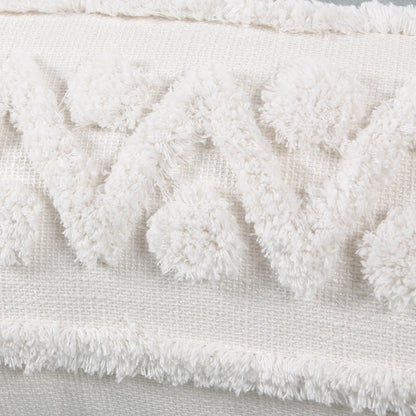 Close-up of a textured white fabric with frayed edges.