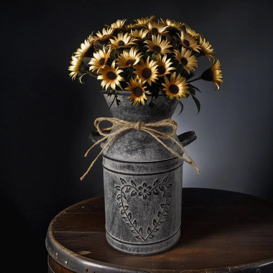 Decorative metal vase with sunflowers on a wooden surface against a dark background