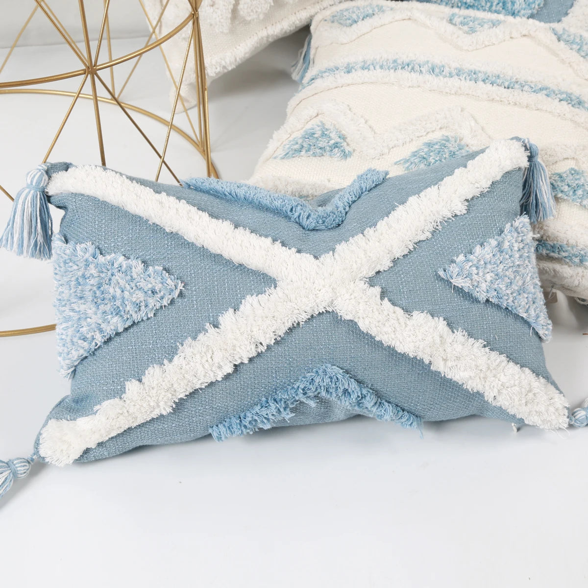 Decorative pillow with blue and white pattern on a light background