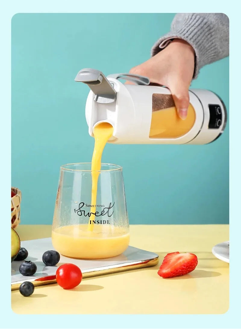 Hand pouring juice from a blender into a glass with a blue background