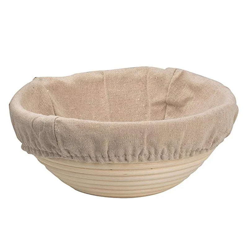 Banneton bread proofing basket with a linen cover on a white background