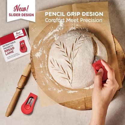 Bread lame with leaf design on bread, surrounded by flour, with promotional text about new slider design.