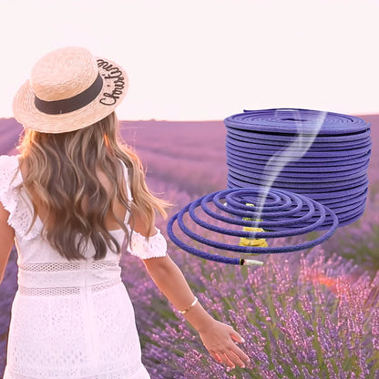 Woman in a lavender field with a roll of incense coils in the foreground