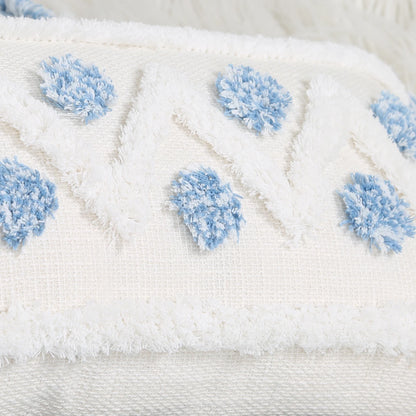 Close-up of a white fabric with blue textured patterns