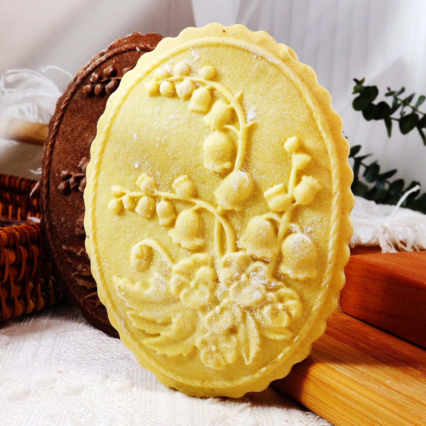 Decorative yellow soap with floral design on a white surface