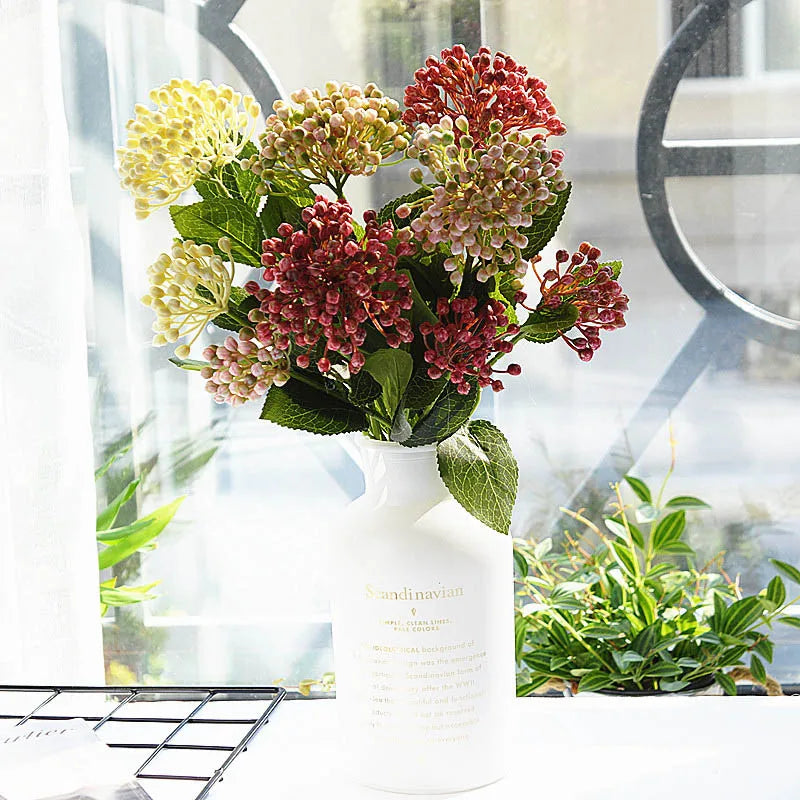Bouquet of flowers in a white vase with a blurred background