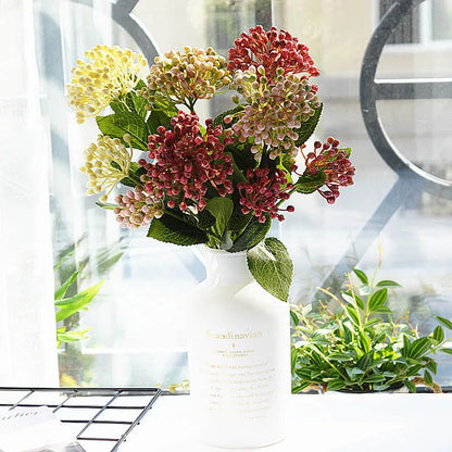 Bouquet of flowers in a white vase with a blurred background