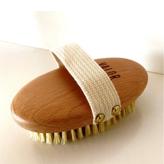 Wooden brush with bristles on a white background