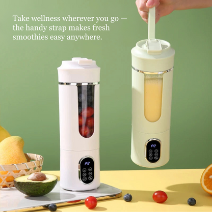 Portable blender with a smoothie inside, surrounded by fruits and vegetables on a green background.