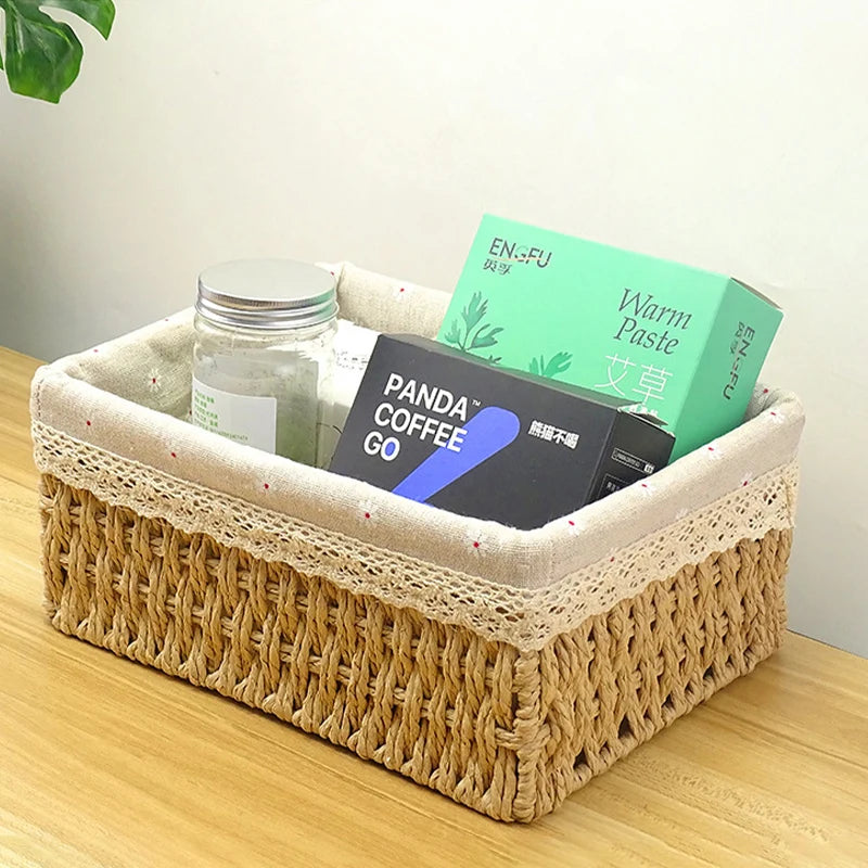 Woven basket with items including a jar and boxes on a wooden surface