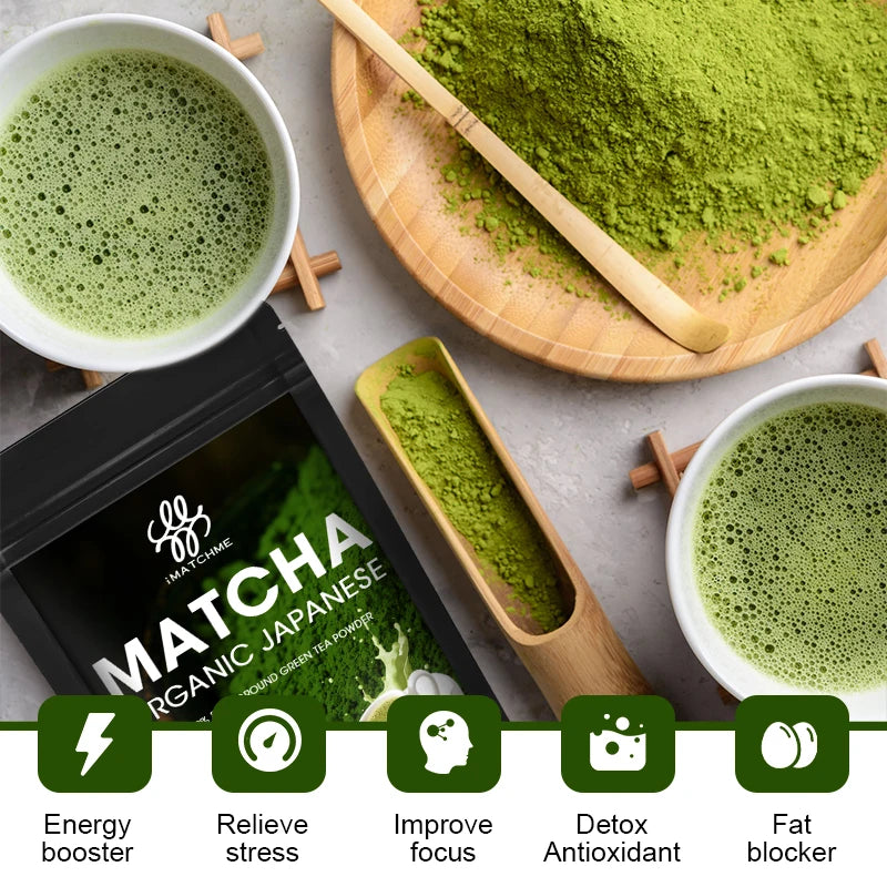 Matcha green tea powder with two cups of matcha, a scoop, and packaging on a gray surface.
