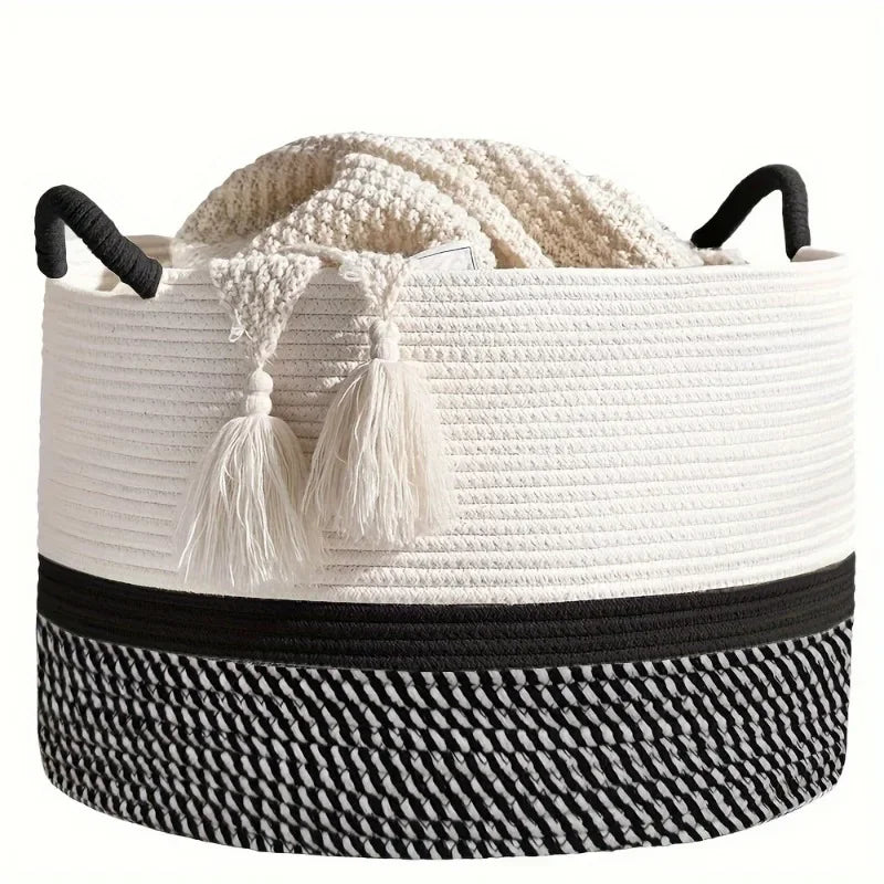 White woven basket with black accents and tassels on a white background