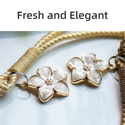 Pair of gold and white flower-shaped earrings on a light background with 'Fresh and Elegant' text.