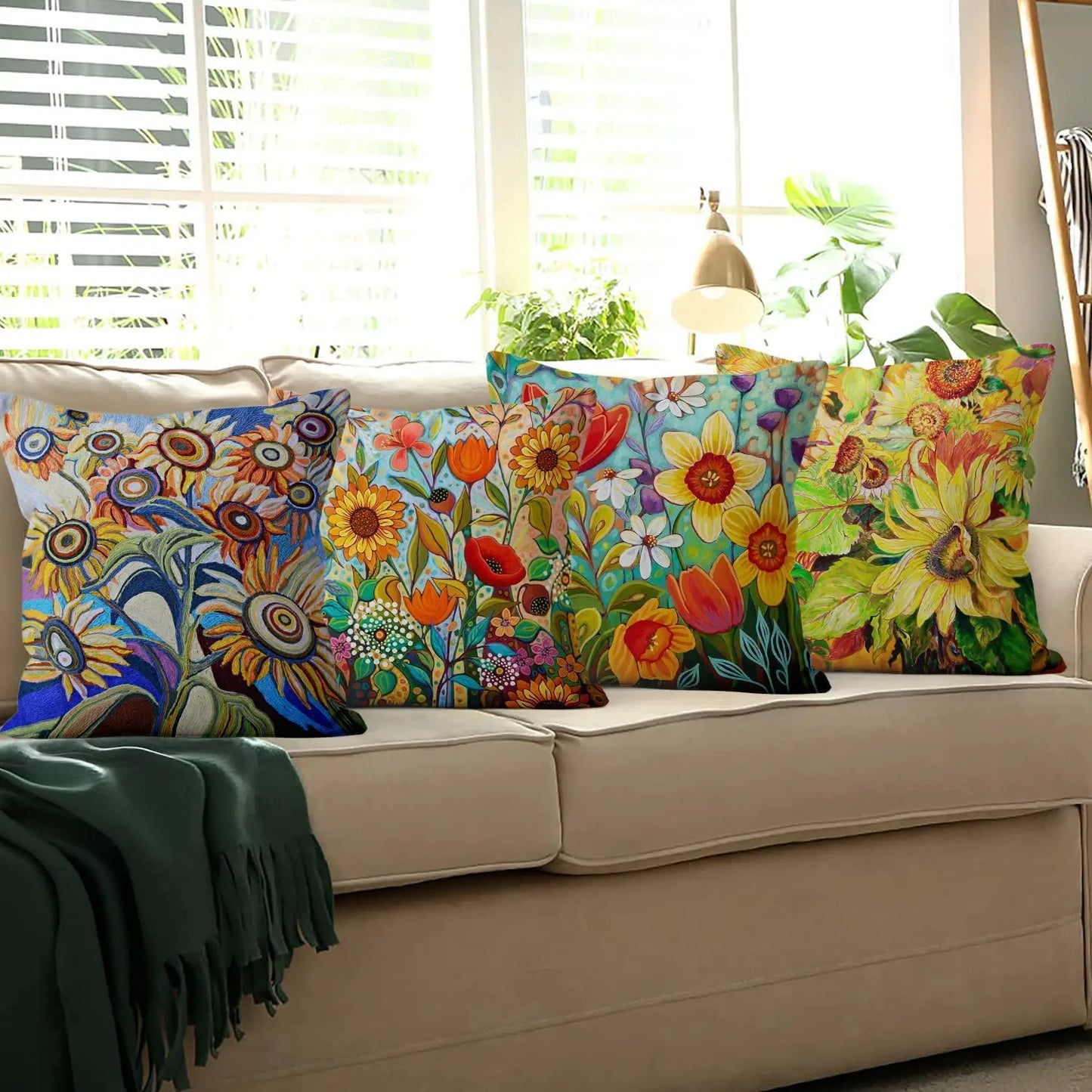 Colorful floral-patterned pillows on a beige sofa with a window in the background