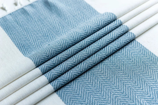 Blue herringbone patterned napkins on white plates