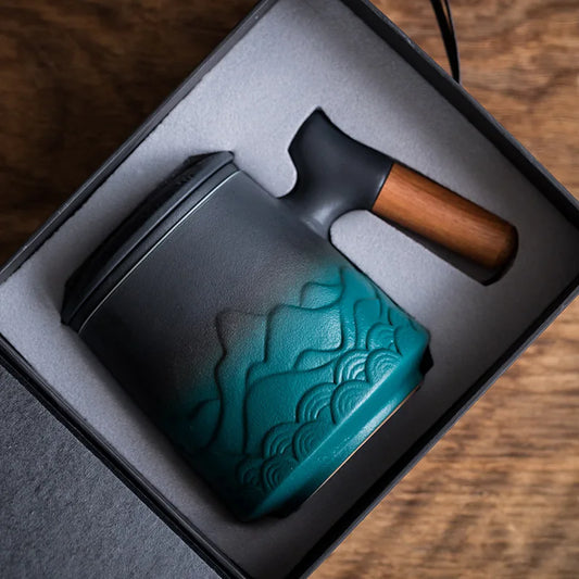 Teal and black tool with wooden handle in a box on a wooden surface